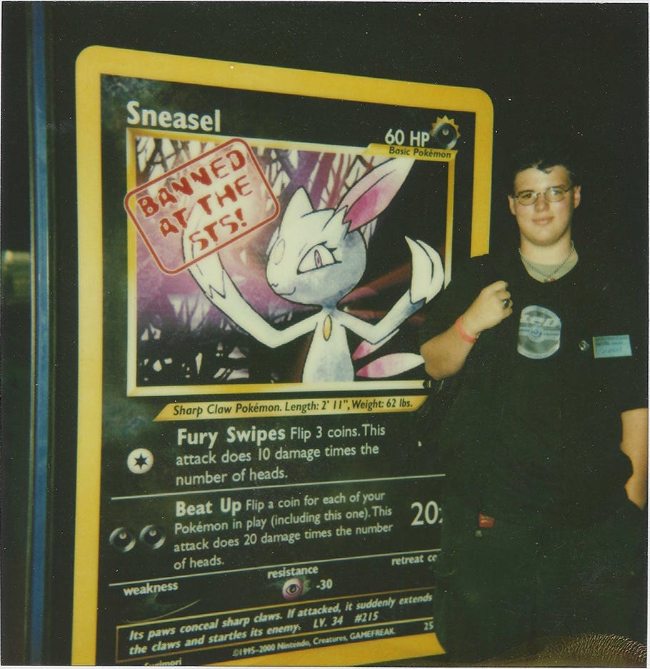Jim standing next to a giant Sneasel card from Neo Genesis, the first Wizards of the Coast Pokémon card to be banned at a major Pokémon event Jim standing next to a giant Sneasel card from Neo Genesis, the first Wizards of the Coast Pokémon card to be banned at a major Pokémon event
