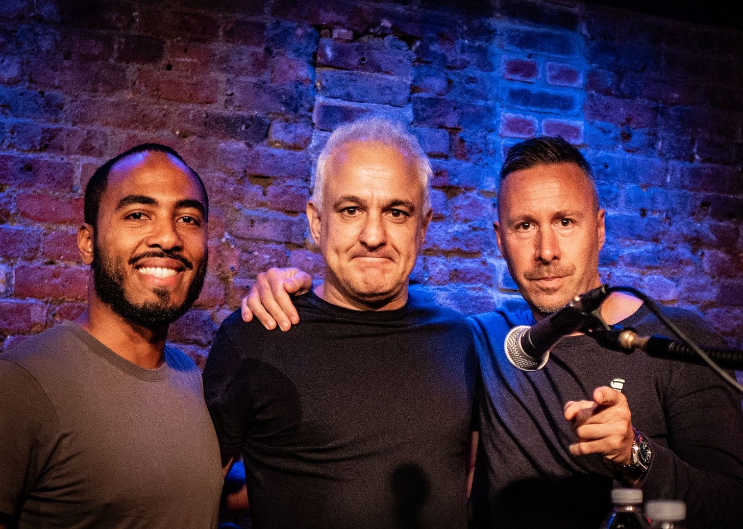 A group of men posing for a photo

AI-generated content may be incorrect.