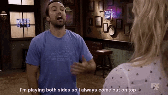 a man in a blue shirt says i 'm playing both sides so i always come out on top in front of a woman