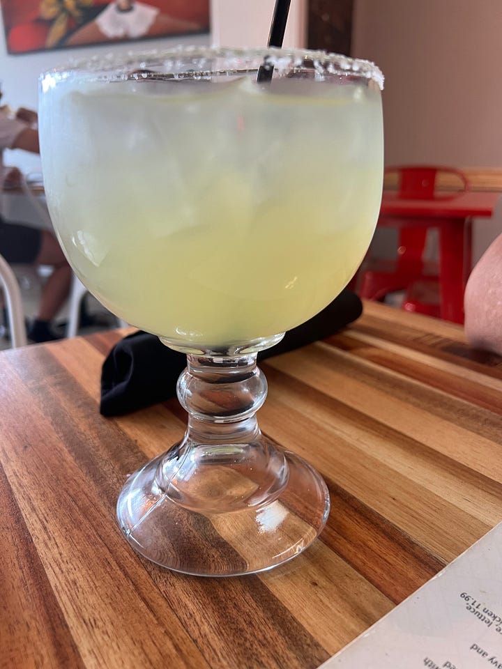 Frida’s drink menu and two different margaritas