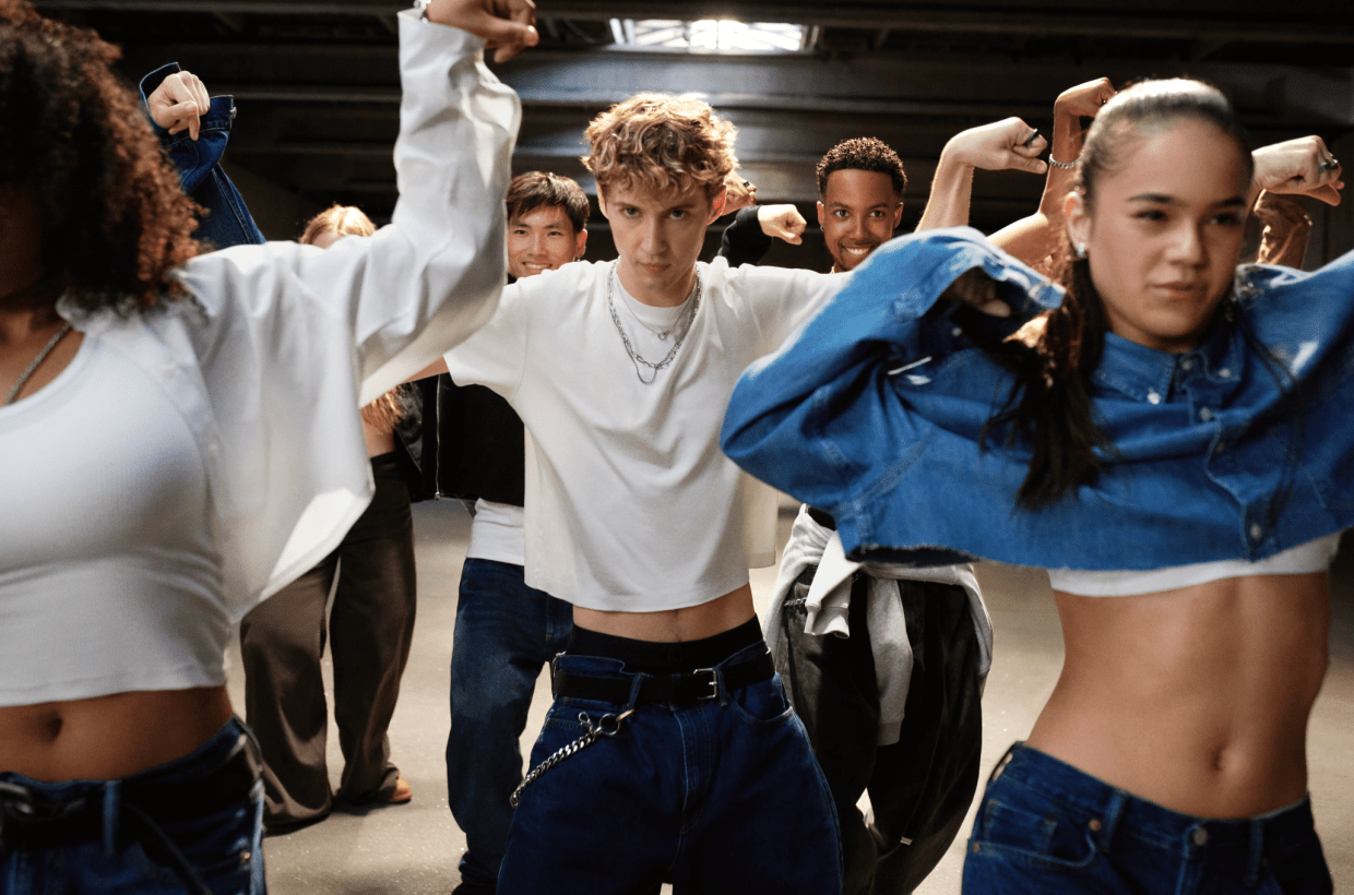 group of people dancing in gap demin