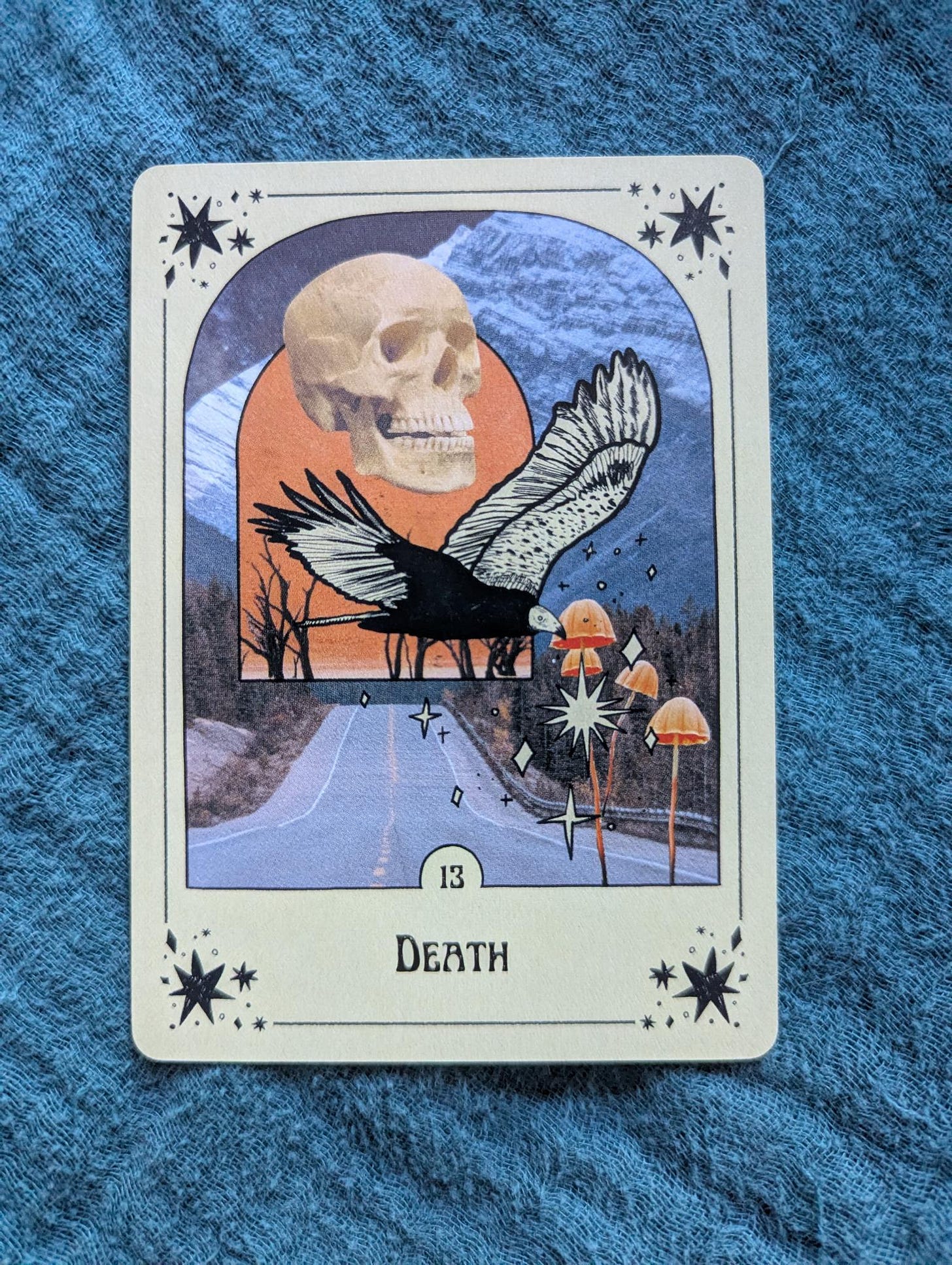 The Death card (deck unknown) on a blue cloth