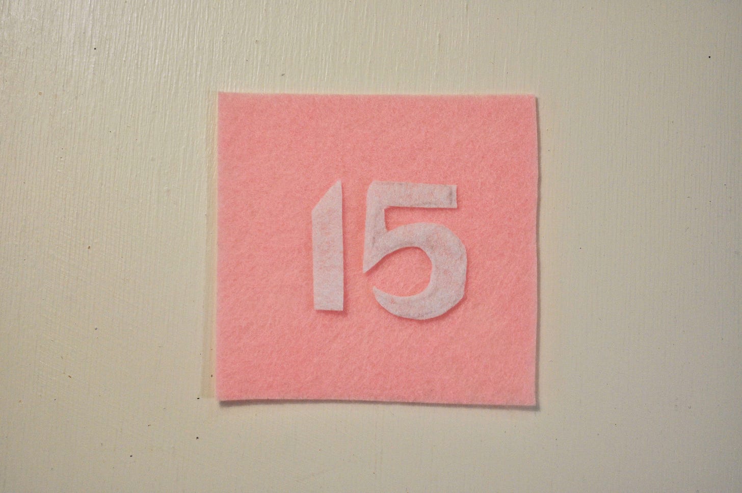 Pink and white felt advent calendar number pocket square