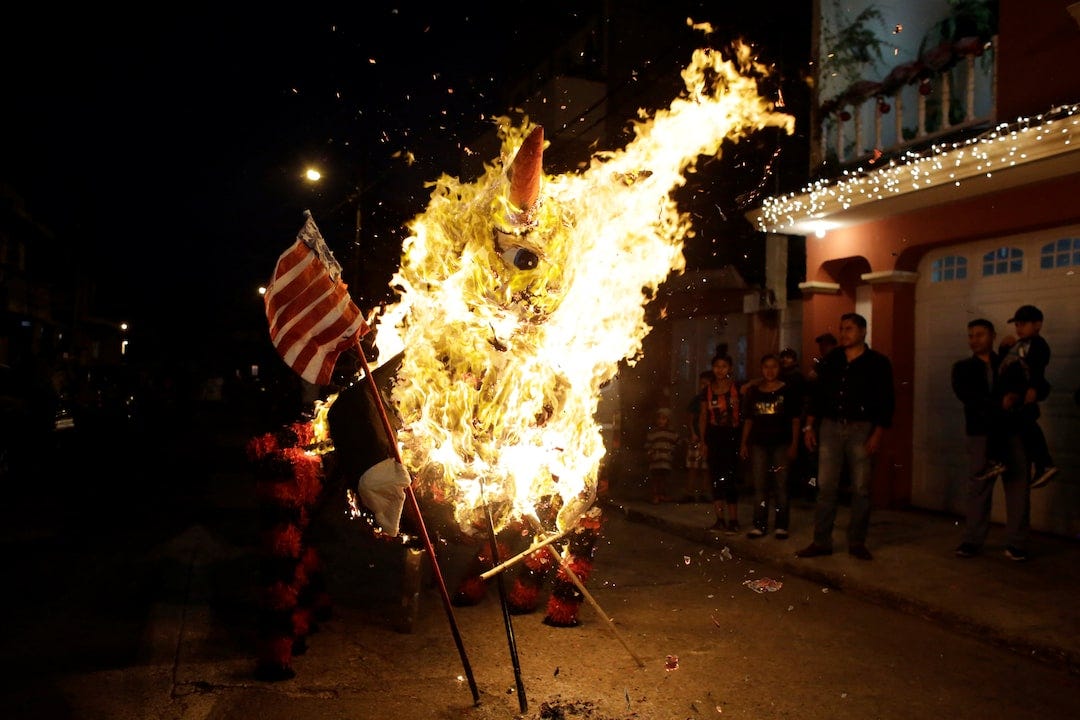 Guatemalans burn Trump effigies to scatter evil spirits | Reuters