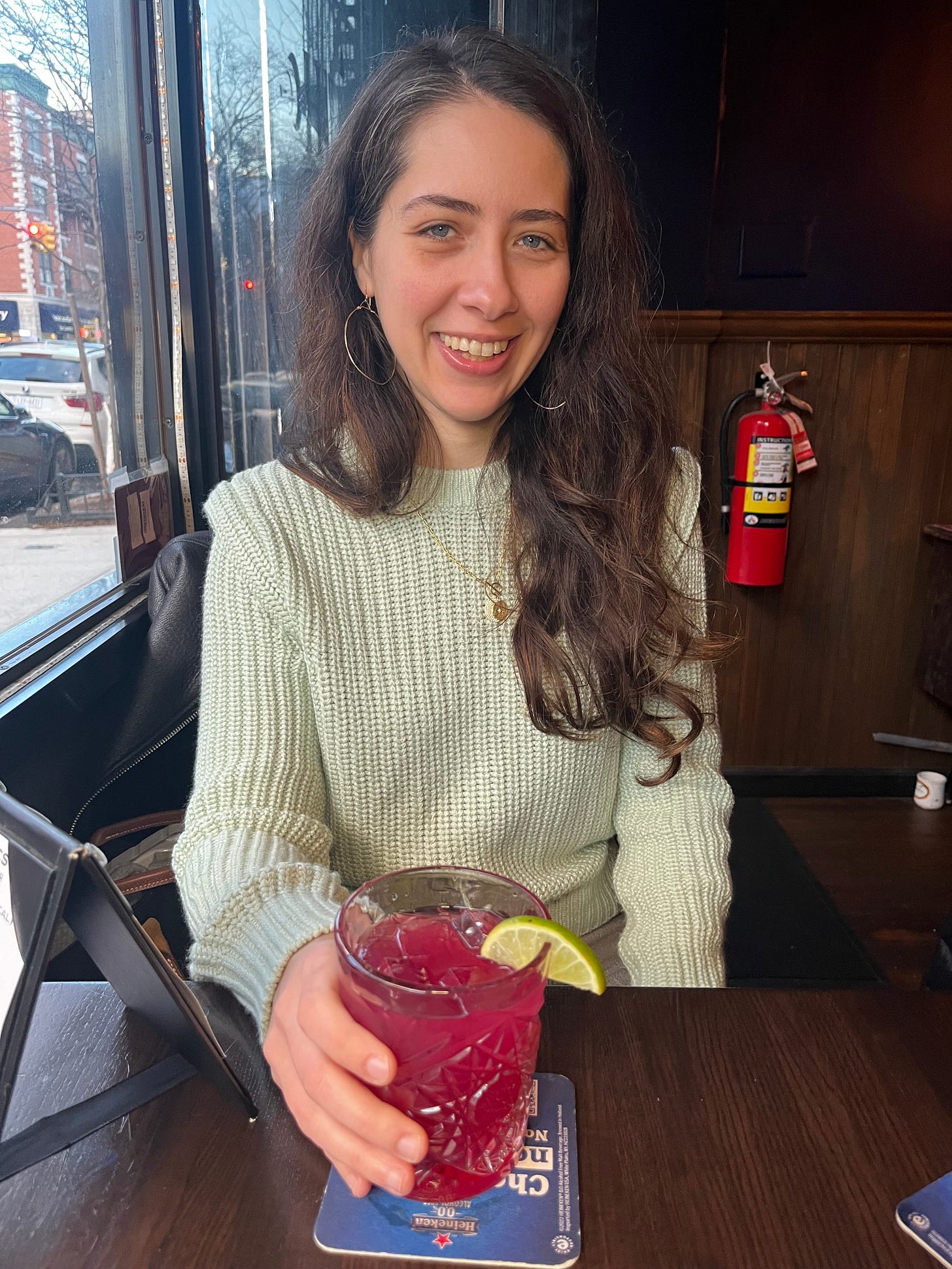 Christina enjoying a zero-proof cocktail at Hekate, a sober dive bar in NYC
