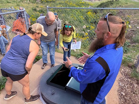 a group tours a wells and springs system and water plant