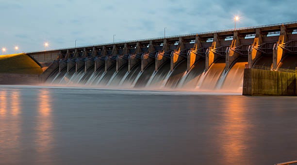 Keystone Dam at Twilight The Keystone Dam in Oklahoma with all the gates open and flowing a lot of water.  Shot at Twilight.  hydropower stock pictures, royalty-free photos & images