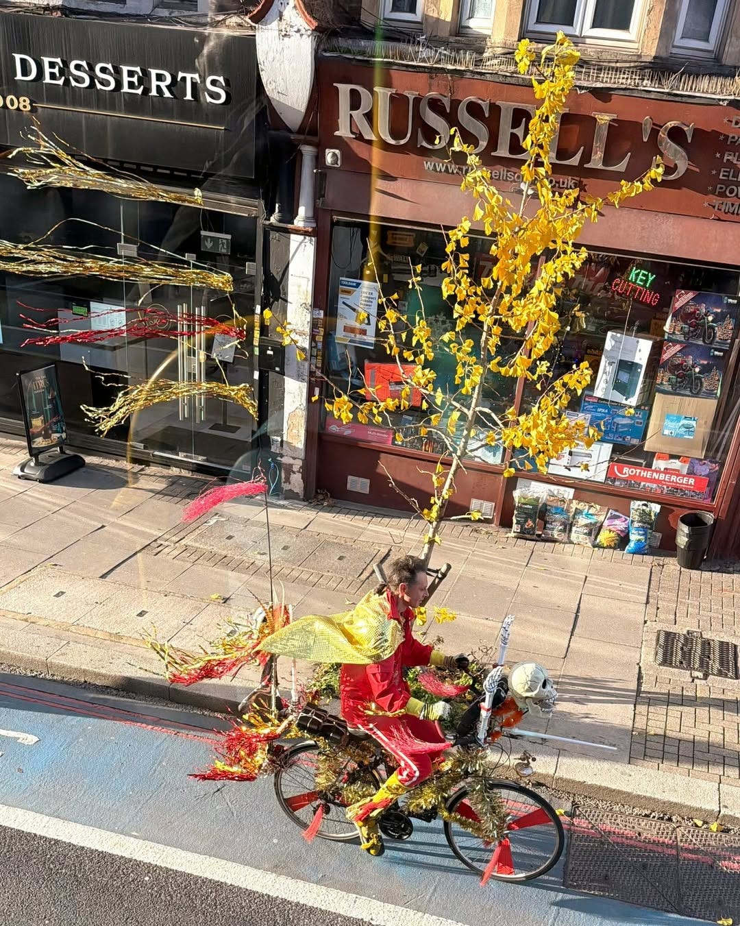 May be an image of bicycle, street and text