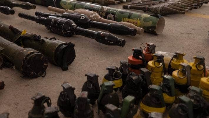 Captured Hamas weapons, including hand grenades and rocket-propelled grenades, are displayed during a news conference for foreign media at a military base in southern Israel on October 20. Captured Hamas weapons, including hand grenades and rocket-propelled grenades, are displayed during a news conference for foreign media at a military base in southern Israel on October 20.