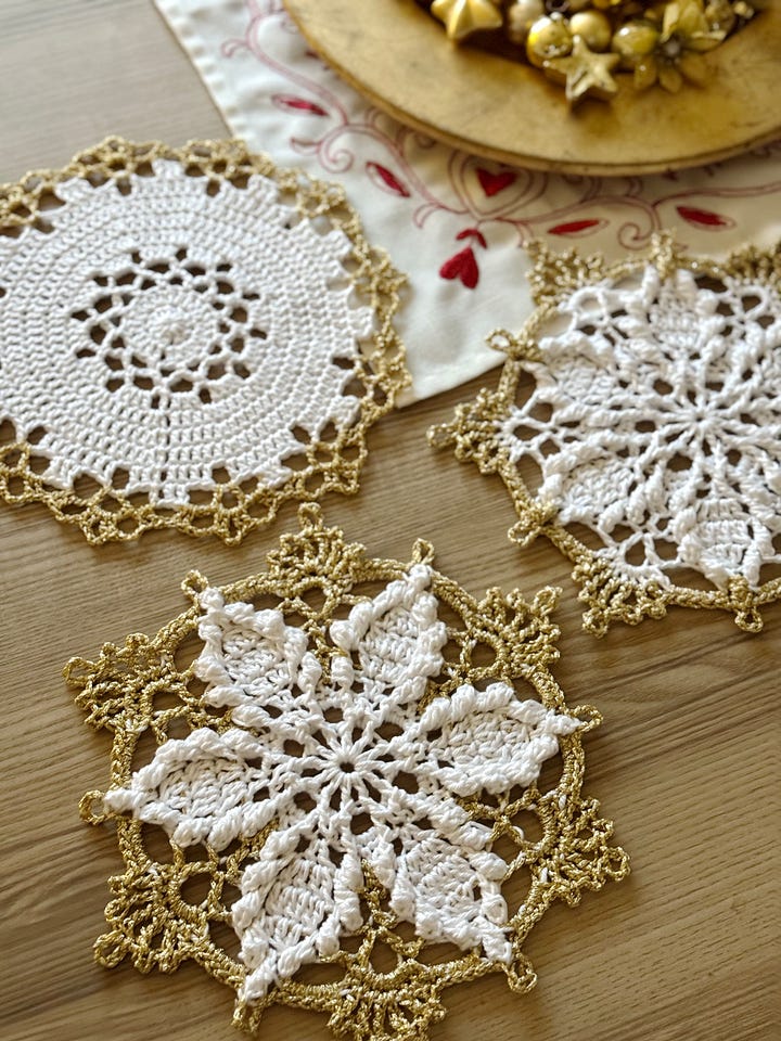 A Father Christmas stitched from felt and set of 3 white doilies with gold trim.