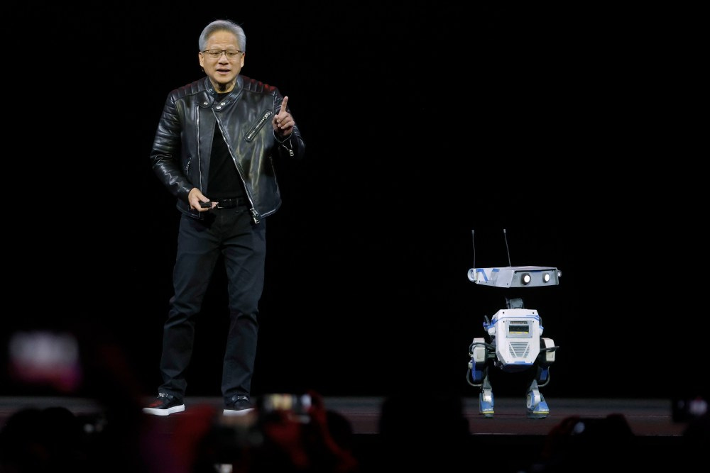 SAN JOSE, CALIFORNIA - MARCH 18: Nvidia CEO Jensen Huang delivers the keynote address with a robot during the Nvidia GTC 2025 at SAP Center on March 18, 2025 in San Jose, California. The annual Nvidia GTC conference runs through March 20th.  (Photo by Justin Sullivan/Getty Images)