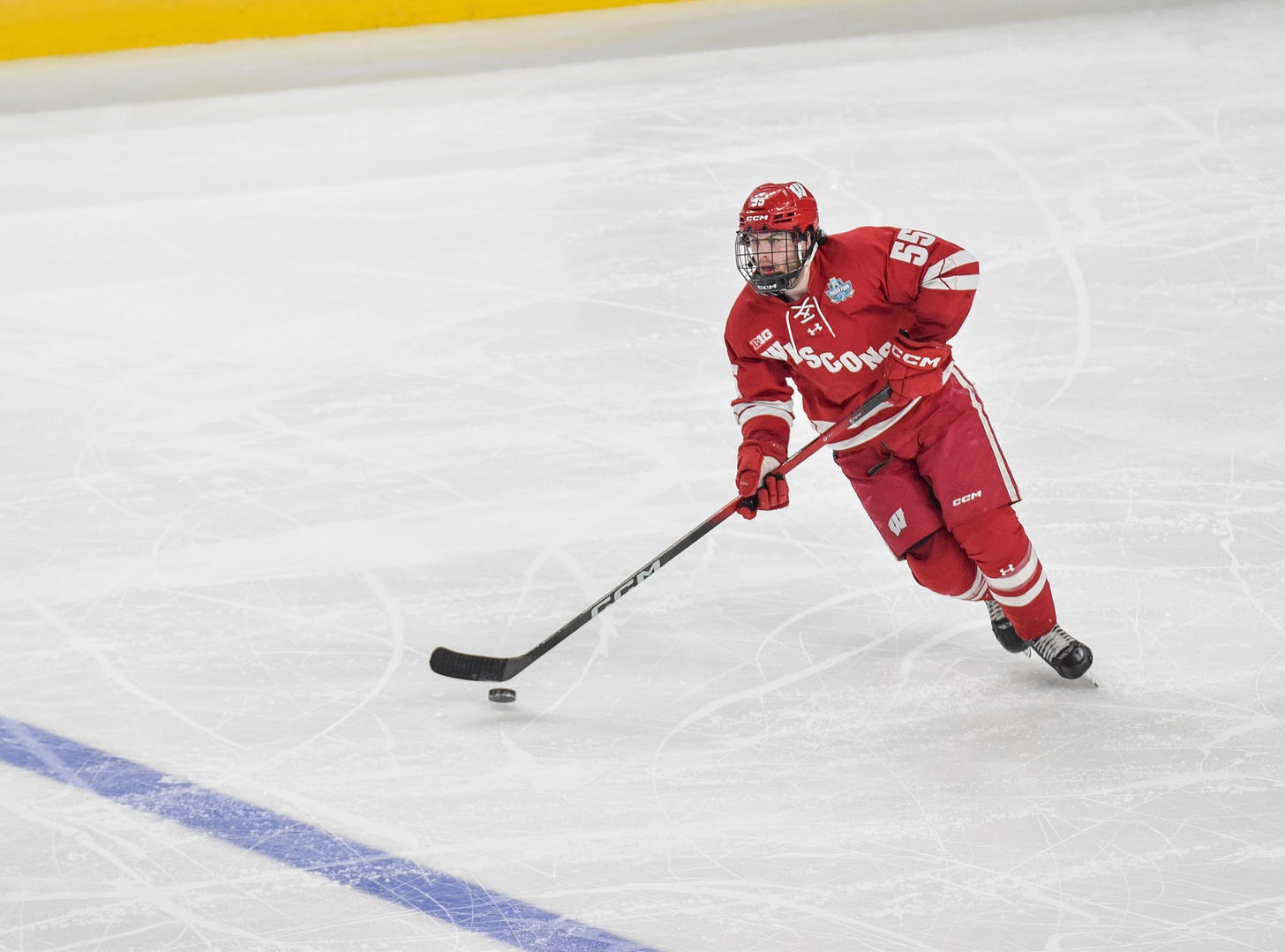 Oliver Tulk states up ice with eyes looking forward and puck floating in air while moving to his left.