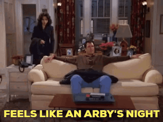 a man is sitting on a couch with the words feels like an arby 's night behind him a man is sitting on a couch with the words feels like an arby 's night behind him