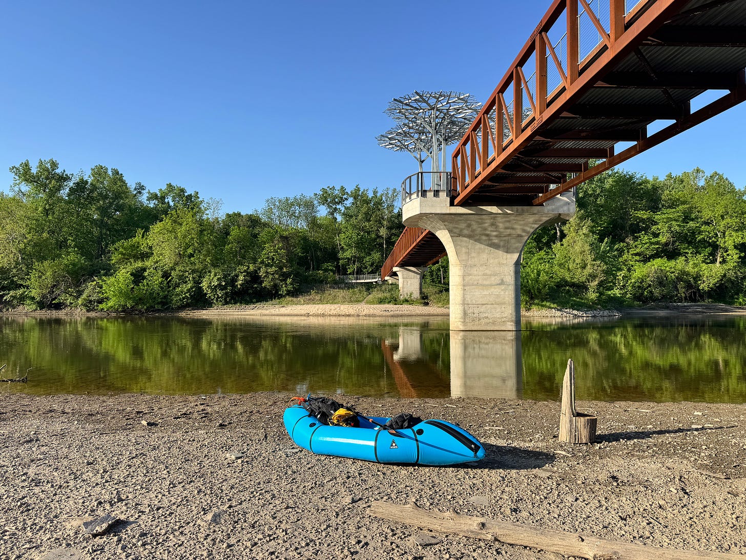 Packraft by river and bridge