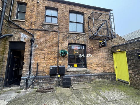 From a quiet street in Deal to the narrow hallway and intimate rooms beyond, the Walk Don't Walk Gallery invites visitors to step inside, be nosey, and discover an art space where humour, conversation and curiosity shape the experience as much as the works on the walls. — © Kent Chronicles