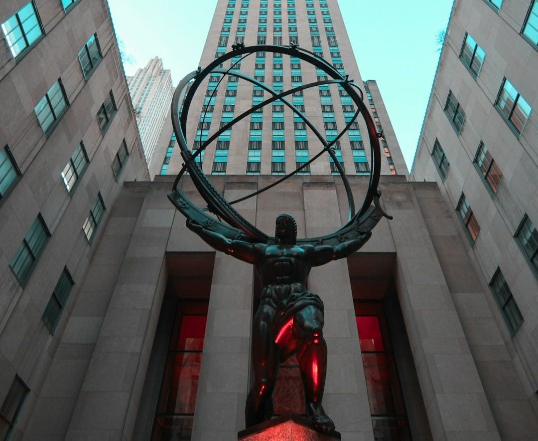 low angle photo of statue low angle photo of statue
