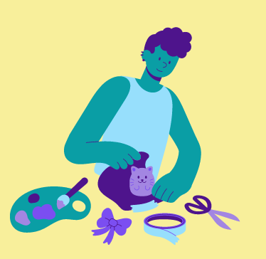 Image of a person surrounded by paint pallet and other hobby materials