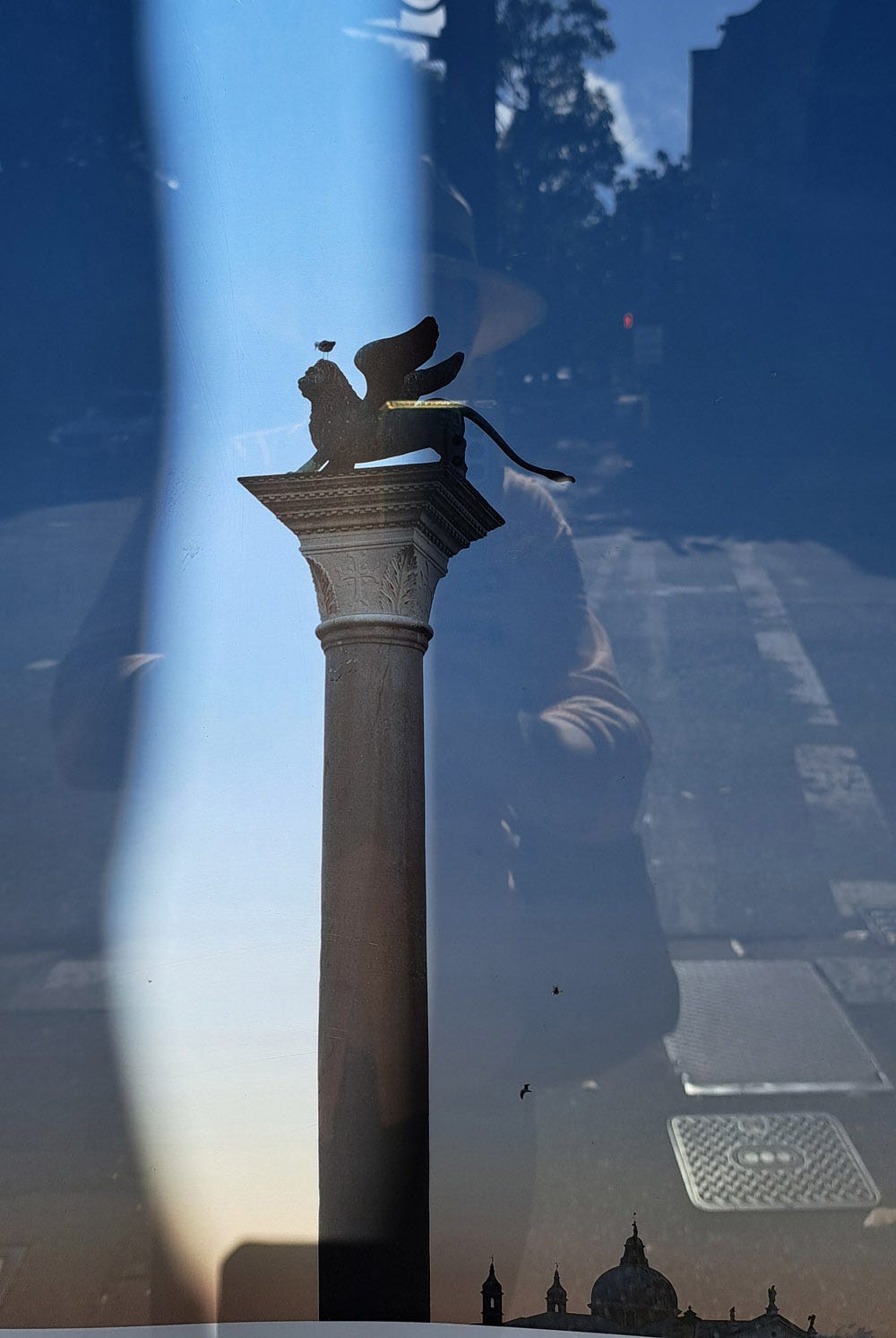 Exhibition poster for La Serenissima with a reflection of the author in Darlinghurst, Sydney