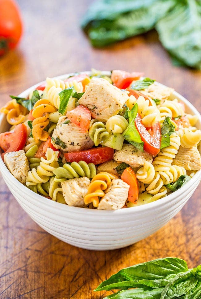 Italian Chicken Pasta Salad - Easy, ready in 20 minutes, and healthy! Bursting with fresh flavors from juicy tomatoes, cucumber, basil, parmesan, and tender chicken tossed in a tangy lemon vinaigrette!! Italian Chicken Pasta Salad - Easy, ready in 20 minutes, and healthy! Bursting with fresh flavors from juicy tomatoes, cucumber, basil, parmesan, and tender chicken tossed in a tangy lemon vinaigrette!!