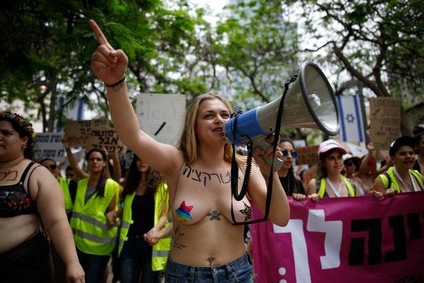 Topless women march through Tel Aviv for annual Slut Walk protesting sexual  violence and harassment - World News - Mirror Online