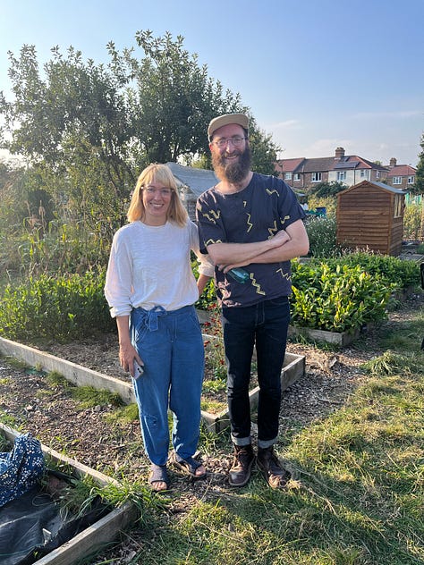 1-2. Exploring a quick extraction of indigotin pigment from indigo plant leaf onto wool fabric, with flax fibre on the table; Liza Mackenzie and Nick Evans stand in the Indigo Garden.