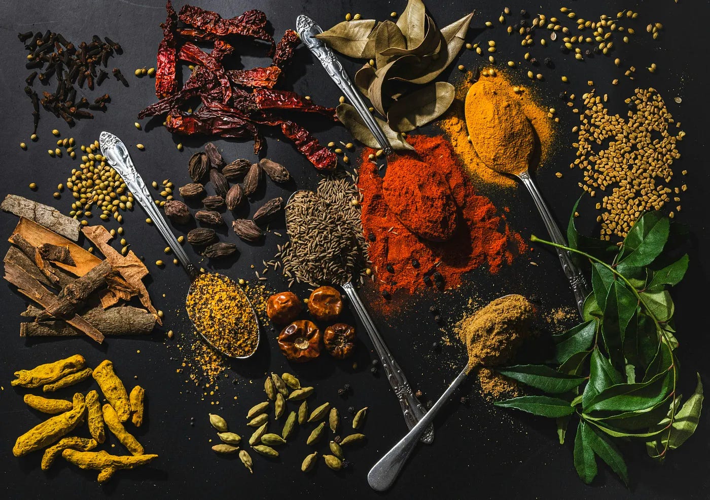 black table with spices strewn about it