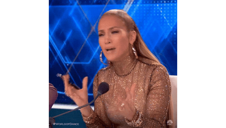 Jennifer Lopez wearing giant hoop earrings and saying "Why?" in a confused way
