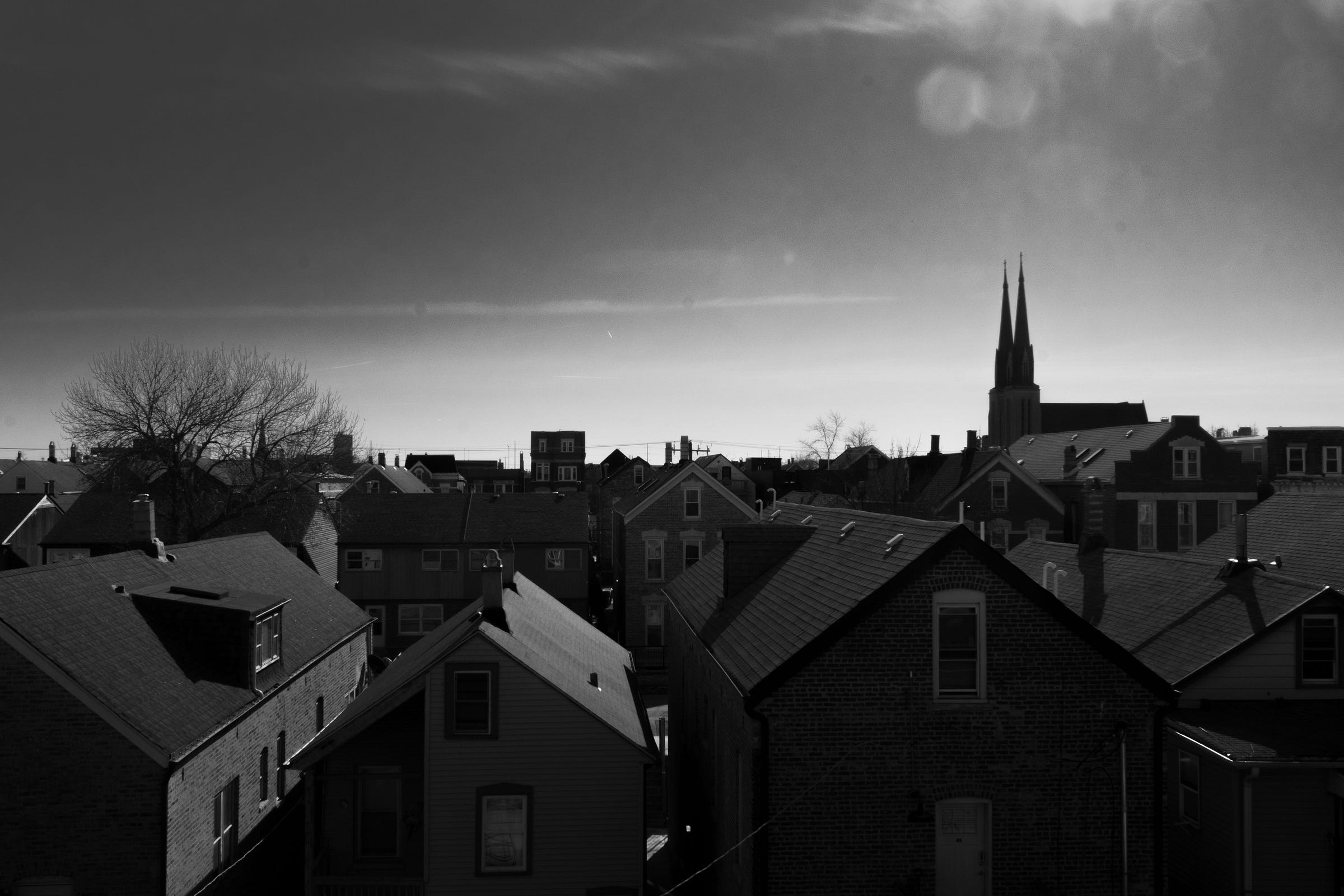 Black-and-white photo of Pilsen rooftops.