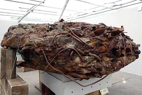 What can cause a variety of materials to fuse into this "meteorite" without generating high heat? What can cause a variety of materials to fuse into this "meteorite" without crushing the survivors in stairwell B, the WTC lobby and shopping mall, the WTC basement levels, 'bathtub' foundation, and PATH trains + station? An excellent video which touches upon the meteorite can be seen below. Relics from the Dust | Directed Energy Weapons (DEW) & 9/11: http://www.youtube.com/watch?v=HrY_PRji34g