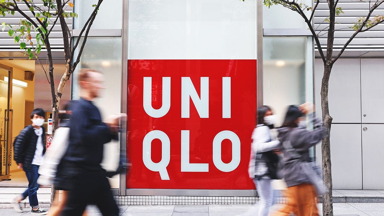 Signage of a Uniqlo store, operated by Fast Retailing Co., in the Shinjuku district of Tokyo, Japan, on Friday, Oct. 28, 2022. Asias largest retailer Fast Retailing is forecasting a record profit for the year ending August 2023, thanks to improving demand for its cheap casual apparel in Japan and a weaker yen bolstering profits brought back home from overseas. Photographer: Kiyoshi Ota/Bloomberg via Getty Images