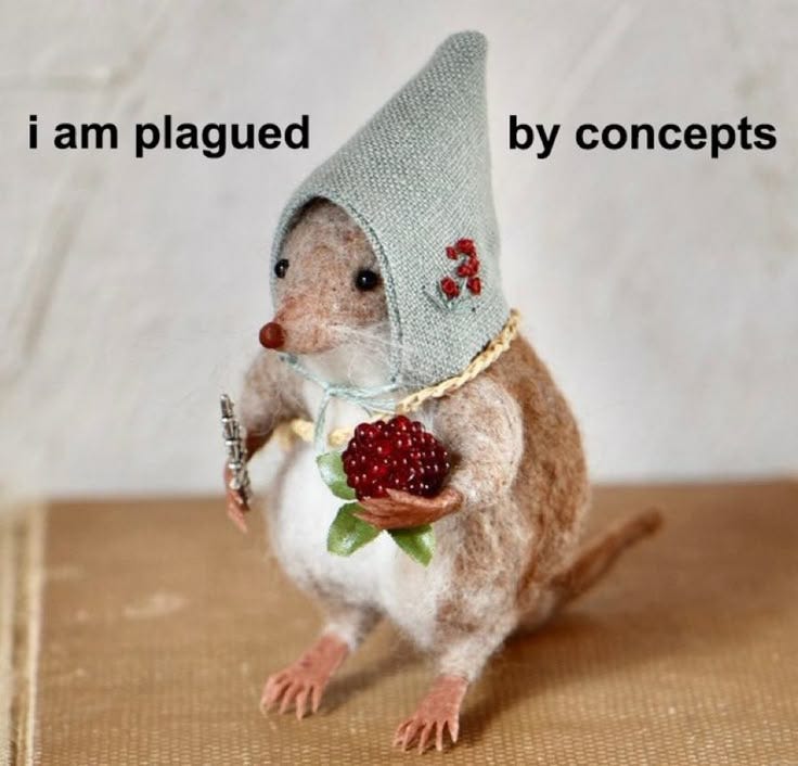 This may contain: a small toy mouse with a hat on it's head holding a raspberry This may contain: a small toy mouse with a hat on it's head holding a raspberry