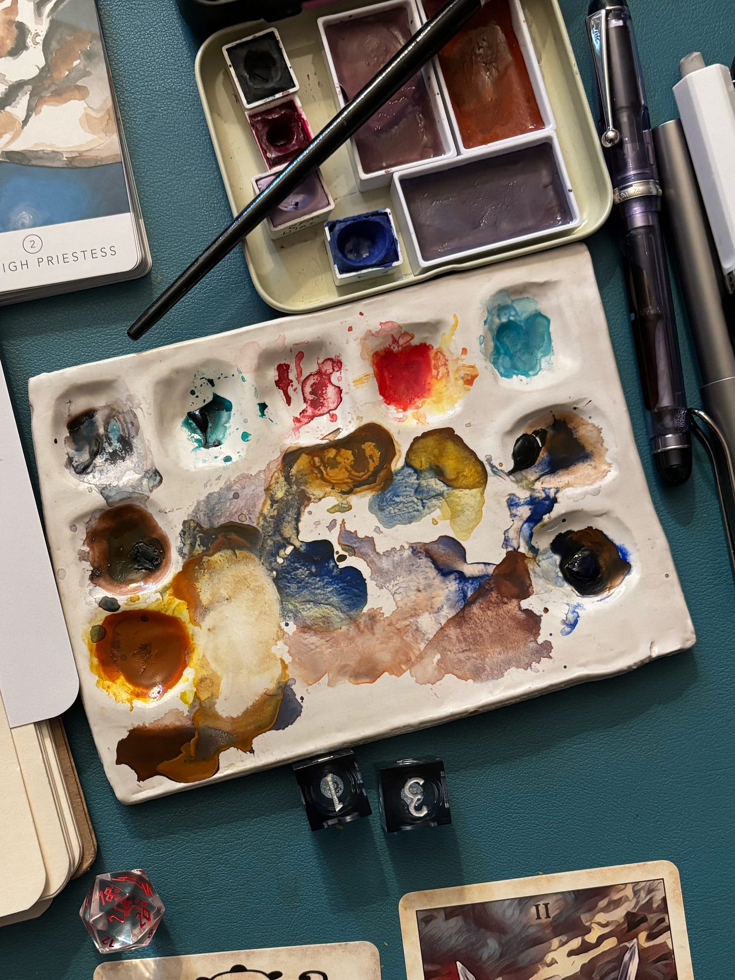 A palette of paint and some half pans