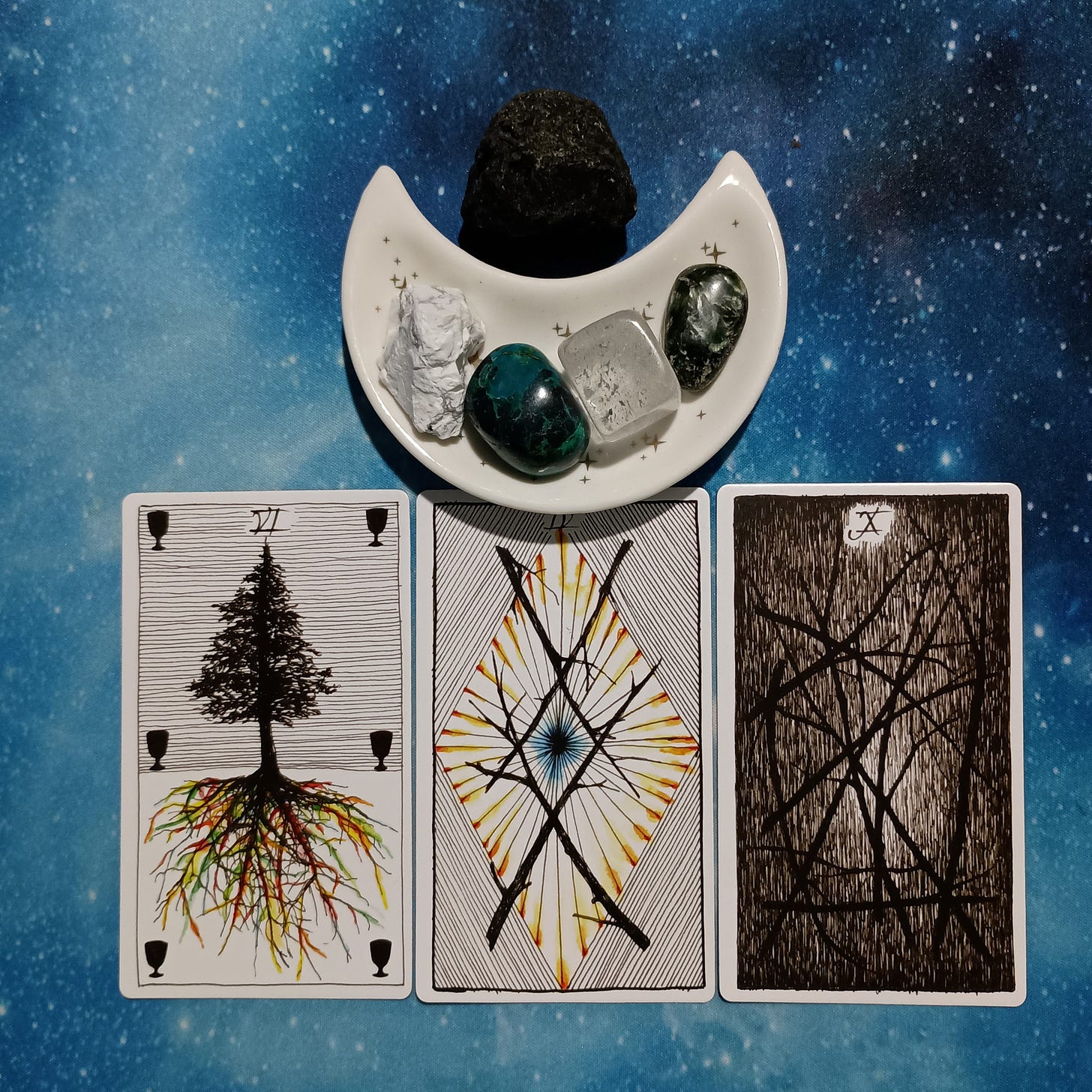 Time to Lighten Your Load!~ A Message From the Universe, 3 Wild Unknown Tarot cards and crystals on a starry blue background Time to Lighten Your Load!~ A Message From the Universe, 3 Wild Unknown Tarot cards and crystals on a starry blue background