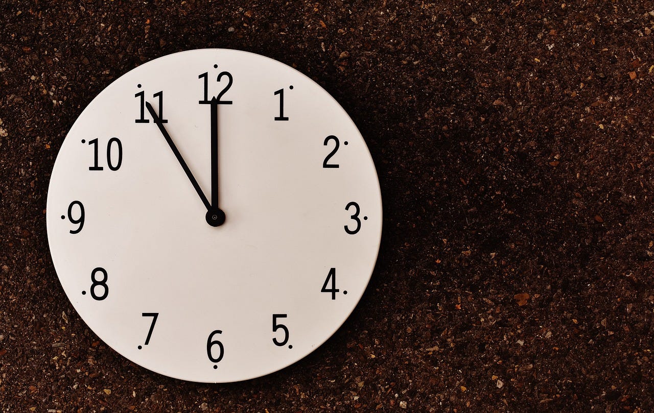 A clock pointing to 11pm. Or 11:55pm.  No-one knows, because no-one uses analog clocks any more.  The ambiguity is deliberate because I like the picture.
