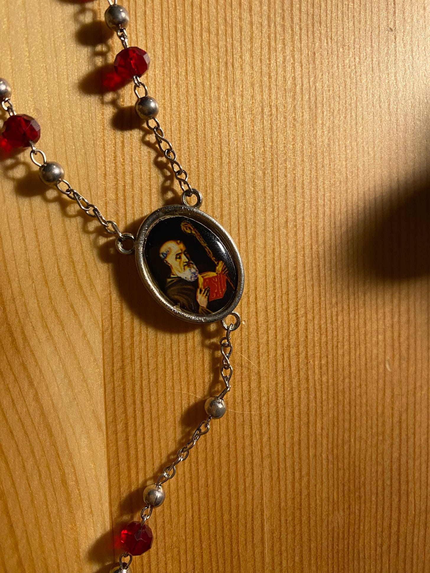 The other rosary is red and silver, the beads remind me of stained glass