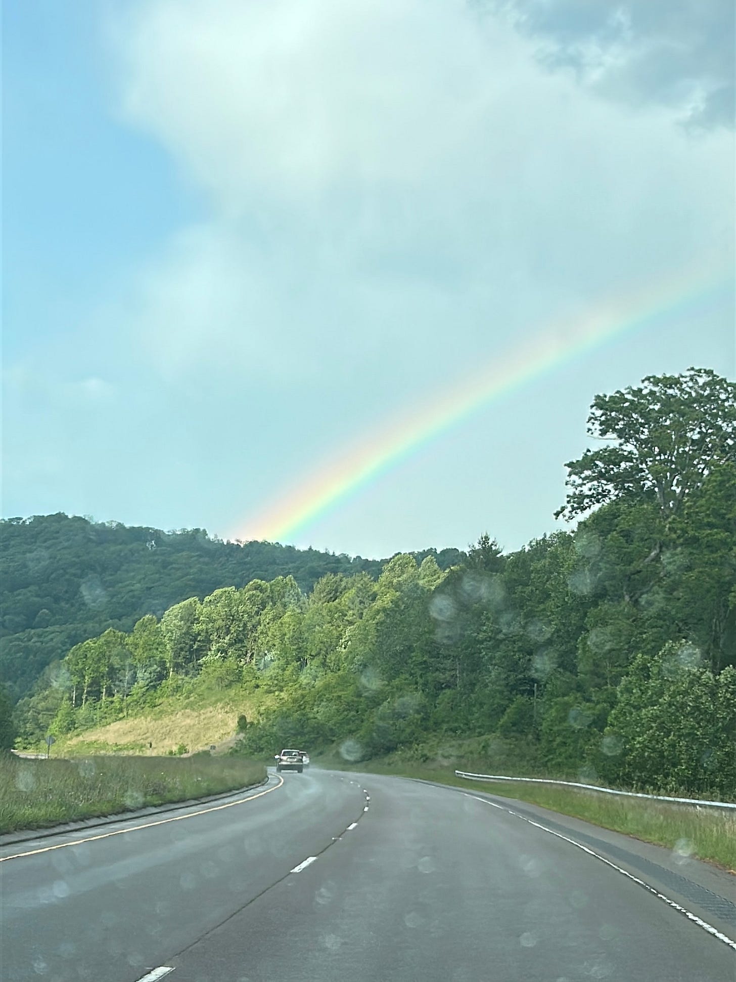 A rainbow in the sky on NC 221 on the way toward the town of West Jefferson A rainbow in the sky on NC 221 on the way toward the town of West Jefferson