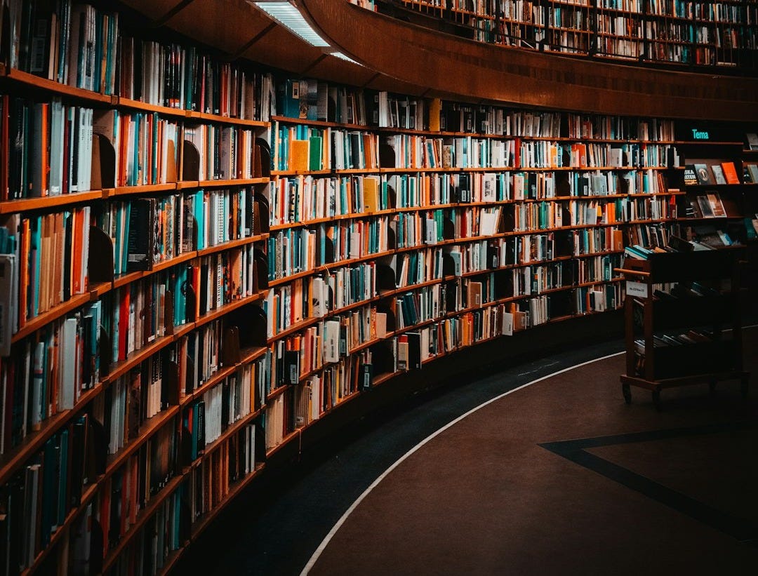 photo of brown wooden bookshelf