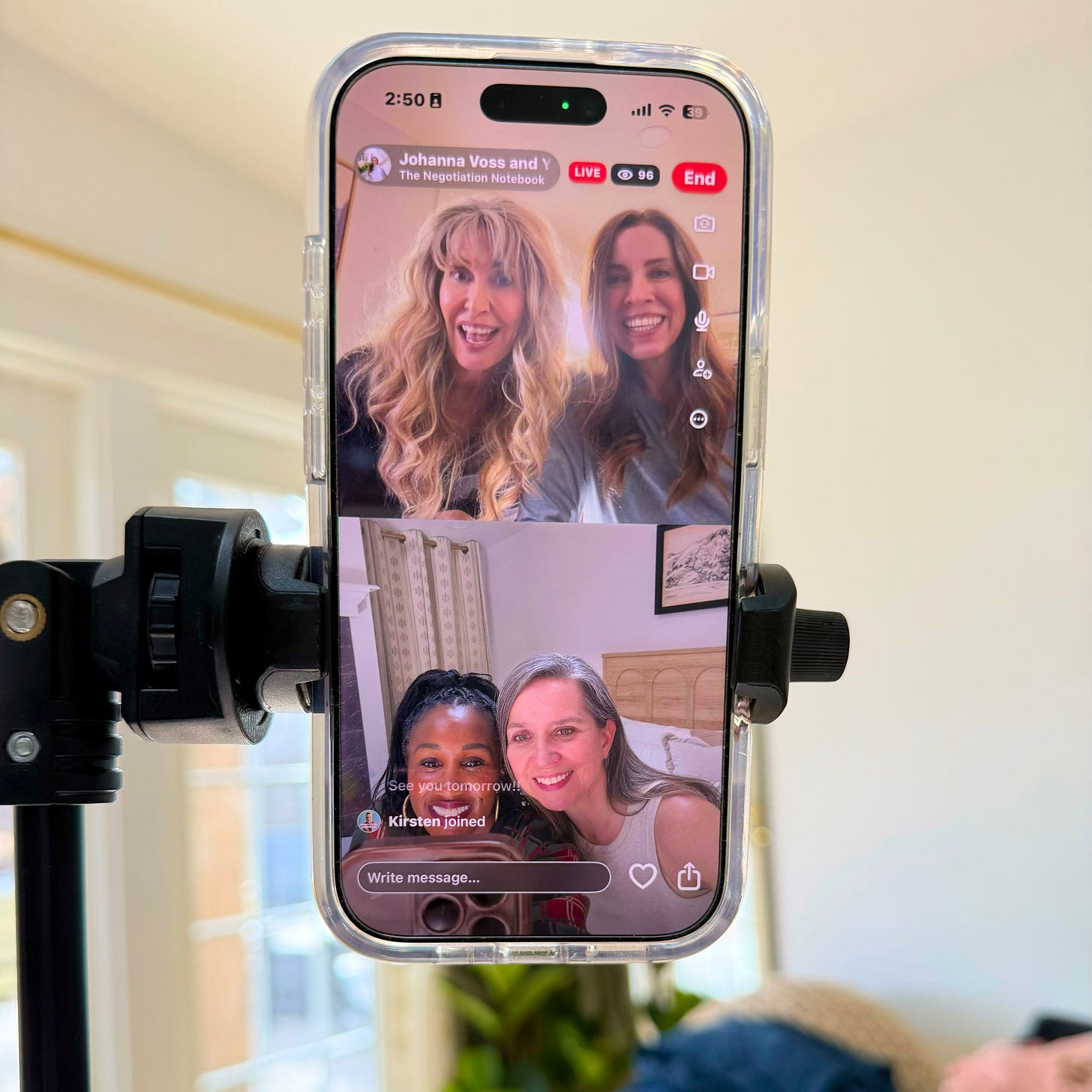 Smartphone on a tripod livestreaming a conversation between women entrepreneurs during a live session titled “The Negotiation Notebook,” illustrating women founders discussing strategy, leadership, and modern business visibility in the AI search era.