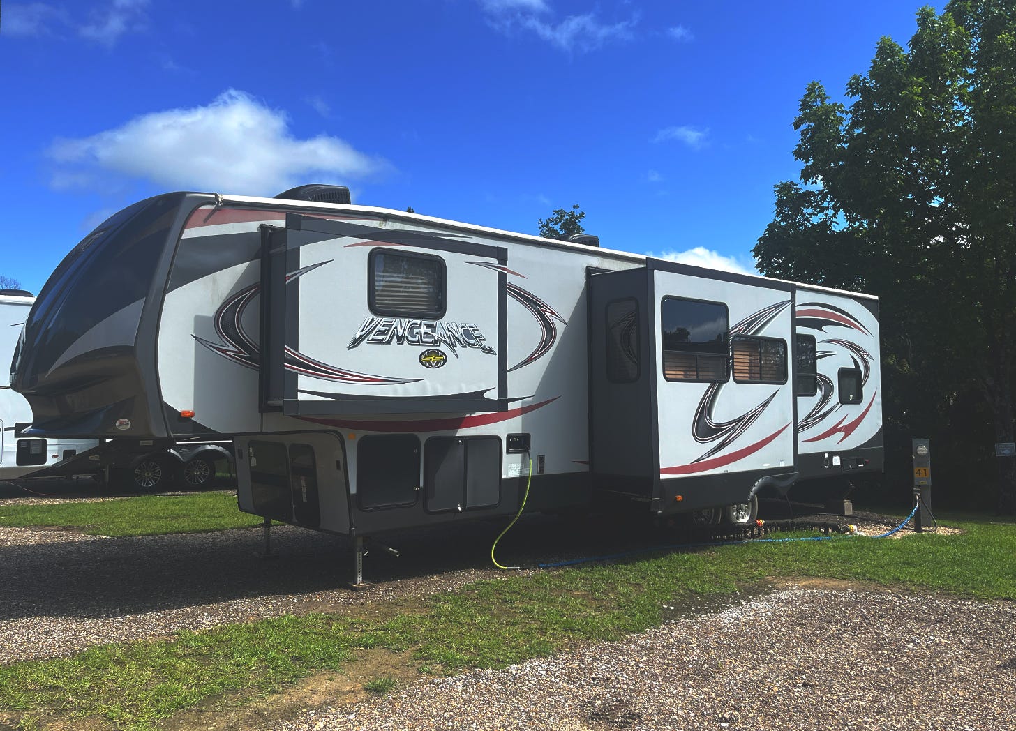 an RV called vengeance parked in a campsite