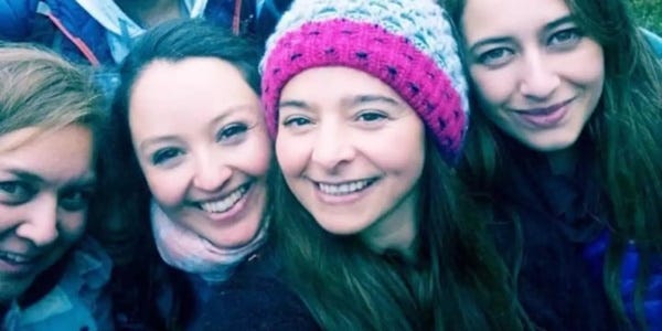 group of hikers with a mysterious shadowy face