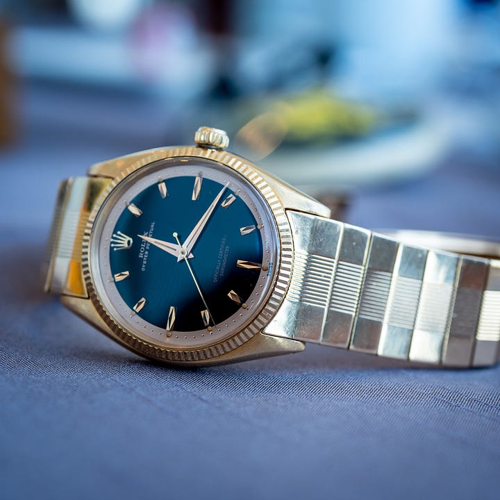A rare Tudor Ranger with 12 Arabic numerals, and an early Rolex with black lacquer dial