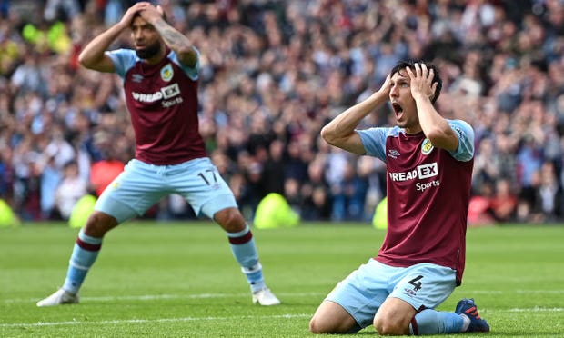 Burnley’s Jack Cork slumps to his knees during the game against Newcastle United. Burnley’s Jack Cork slumps to his knees during the game against Newcastle United.