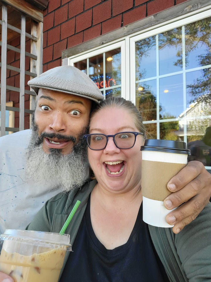 A selfie of Emily and Eugene holding lattes outside of Coruncopia Sweets and a photo of Highway 61 heading north. There are several vehicles in the lane heading north and a long line of vehicles in the lane headed south.