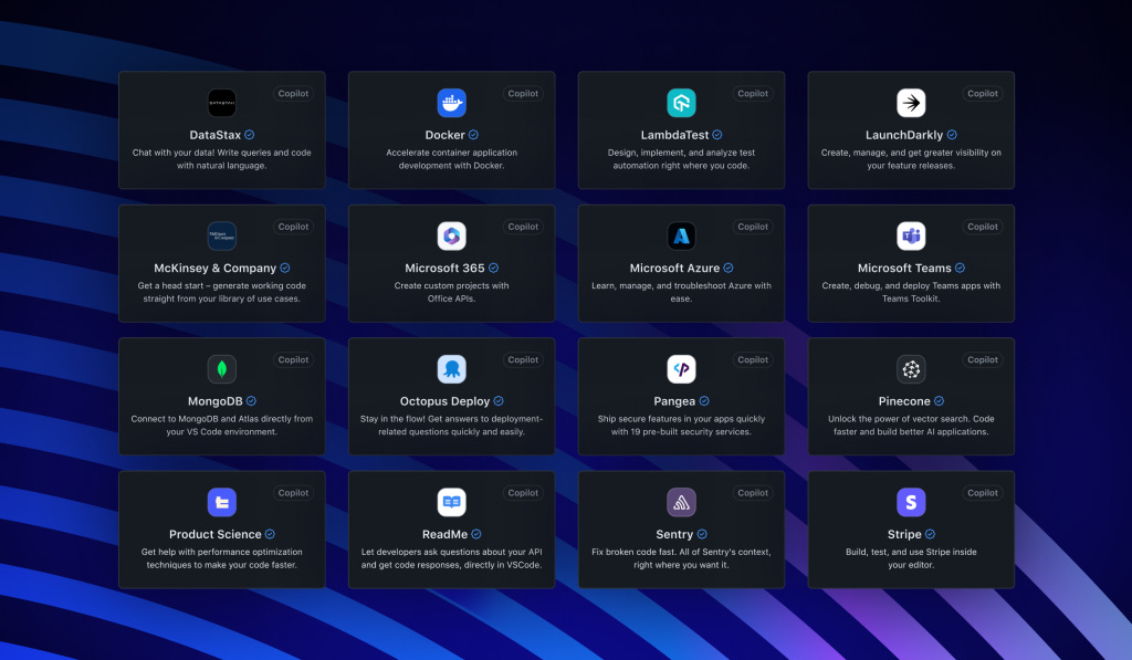 A imagem mostra uma tela de computador com uma espécie de menu, em forma de 16 retângulos. Cada retângulo contém ícone, nome e descrição de um serviço que será possível operar por linguagem natural no GitHub Copilot, como DataStax, Docker, LambaTest, MongoDB, Stripe, entre outros.