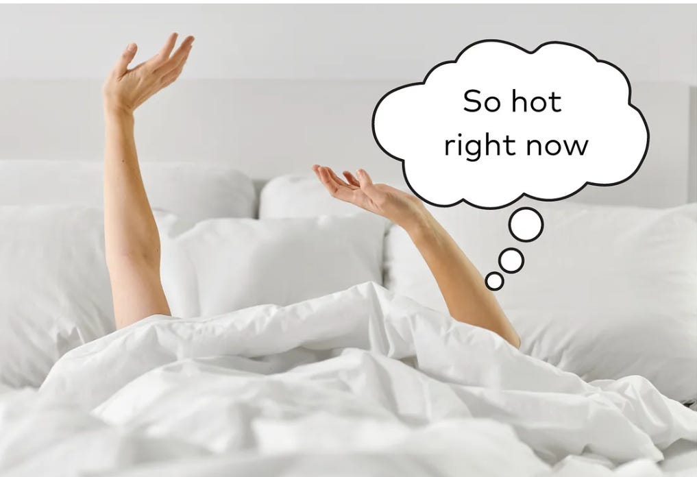A woman under her duvet with a speech bubble that says "so hot right now"