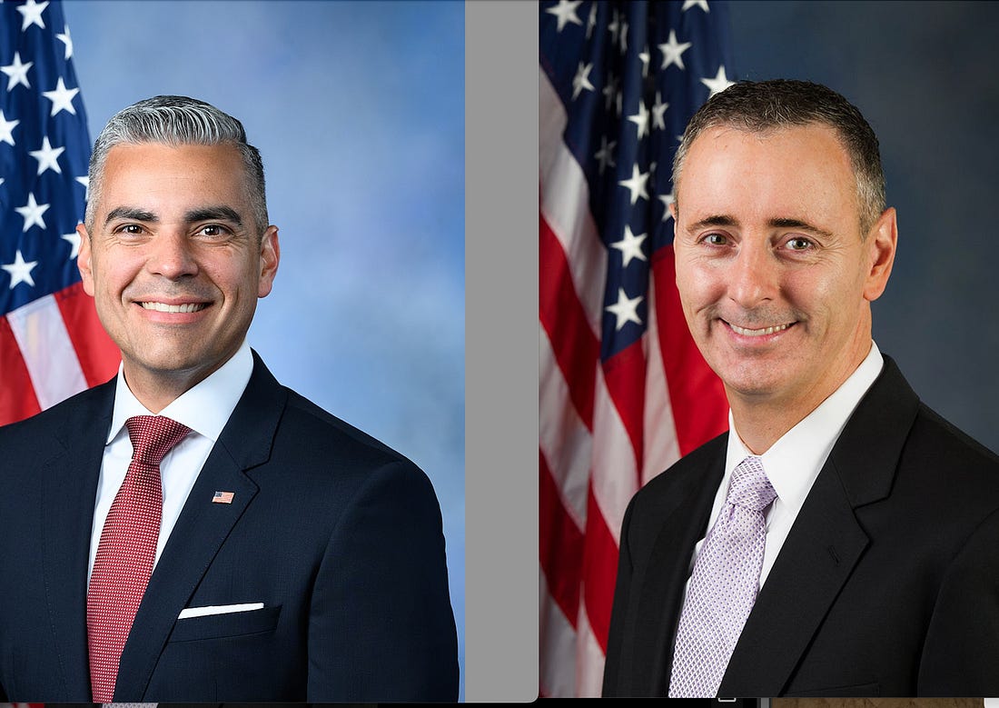 Two official portraits side by side with a grey border between. On left, Juan Ciscomani, Hispanic middle-aged man with grey slicked back hair, smiling, red tie, flag pin, dark suit; on right, Brian Fitzpatrick, middle-aged white man, very short dark hair with some grey, smiling, pale tie; both are standing with flags behind them to their right. Two official portraits side by side with a grey border between. On left, Juan Ciscomani, Hispanic middle-aged man with grey slicked back hair, smiling, red tie, flag pin, dark suit; on right, Brian Fitzpatrick, middle-aged white man, very short dark hair with some grey, smiling, pale tie; both are standing with flags behind them to their right.