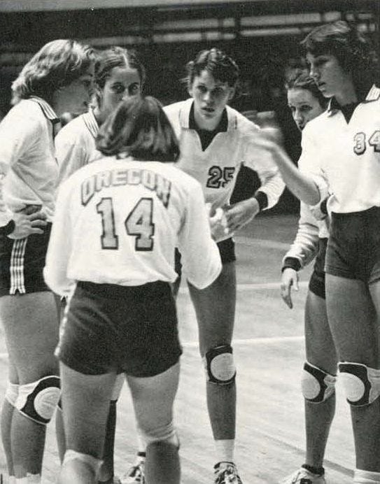 This may contain: a group of young women standing around each other on a basketball court in shorts and knee pads This may contain: a group of young women standing around each other on a basketball court in shorts and knee pads