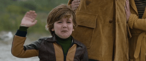 weird little boy crying and waving