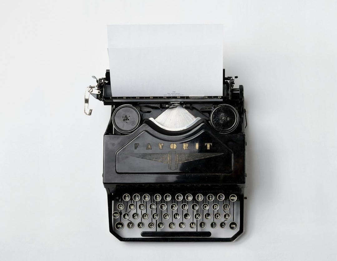 black Fayorit typewriter with printer paper black Fayorit typewriter with printer paper