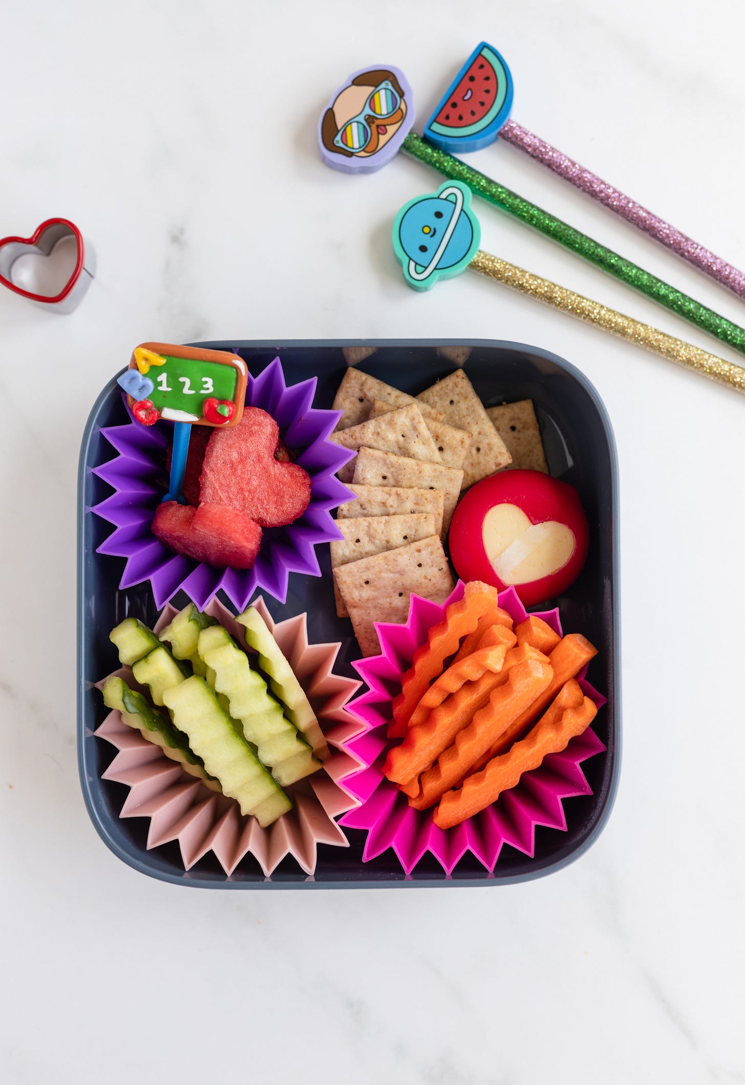 a snack box of veggies, crackers and cheese a snack box of veggies, crackers and cheese